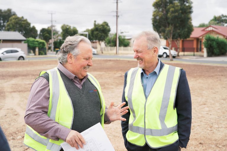 Gino Bria of AnglicareSA with Clayton Hunt, Normus Managing Director at construction commencement sod turn Mansfield Park